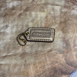 NWOT Mini Bronze Coach Hang Tag